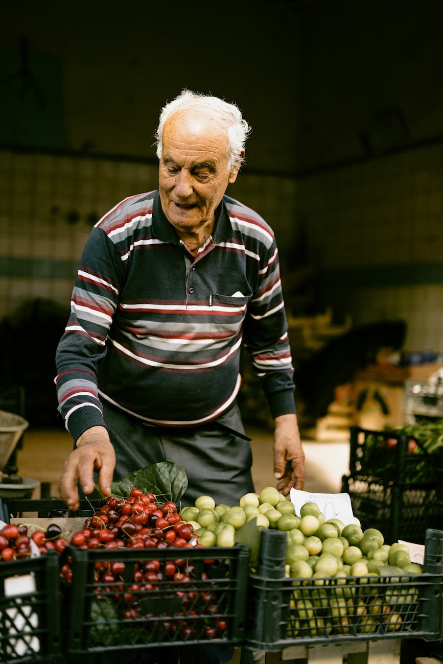 man selling fresh fruit at a market