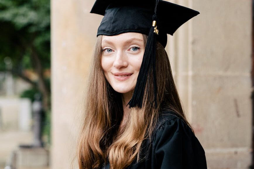 portrait of woman in black academic dress