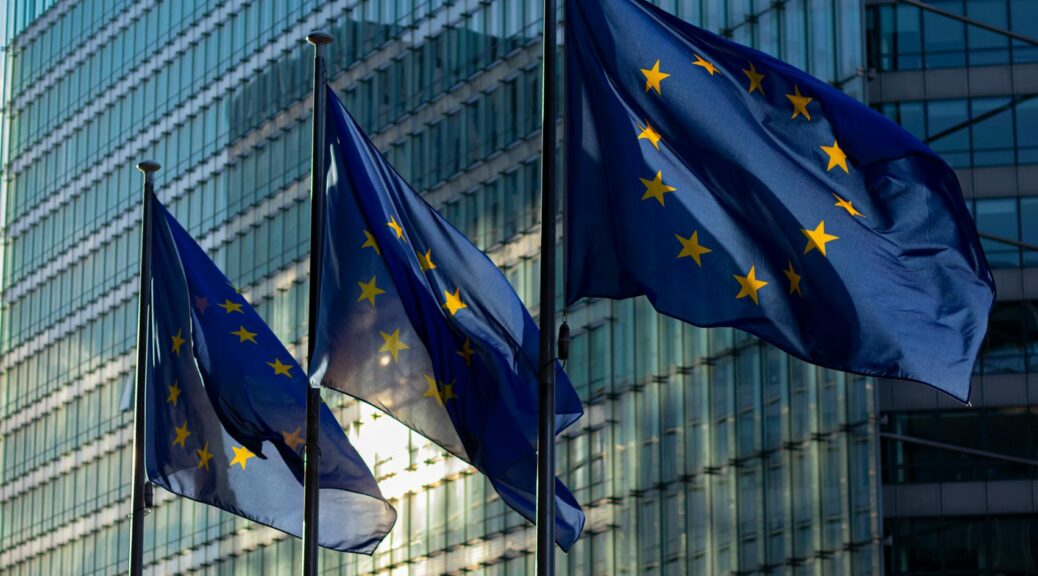 european commission flags on poles